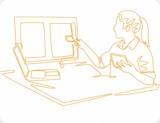 Line drawing of a designer laying out screens on a drawing board